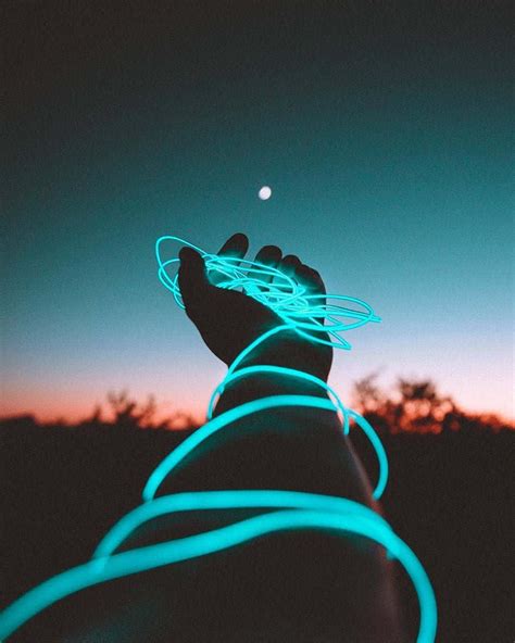 Download A bright light shining on a dark night | Wallpapers.com