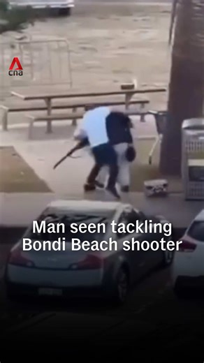 Replying to @CNA A man was seen tackling one of two alleged shooters at Sydney's Bondi Beach on Sunday (Dec 14). The shooting left at least 12 dead, including one of the attackers, and multiple injured. Authorities say the second shooter is in critical condition. Australian police say the shooting targeted the Jewish community and the incident has been classified as a terrorist attack. It happened at an event celebrating the Jewish festival of Hanukkah. #australianews #australia #bondibeach #syd