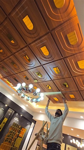 Interior Xpression on Instagram: "Transforming a Plain Ceiling into a Royal Statement! 👑🏠 Watch how we completely change the vibe of this space using our viral Arch Design Wooden 3D Mirror Panels. Who said ceilings have to be boring white? 💡 Why Choose These Panels? • The "Wow" Factor: The Arch design brings a Neoclassical touch to modern interiors. • Light & Space: The built-in mirror catches the light, brightening up the whole room. • Zero Mess Installation: Get a luxury wooden finish look