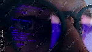 Adult Man Eyes in Glasses Looking at PC Screen and Working on Computer Code Close Up. Eyeballs in AI Eyewear of One Person Learning Online at Night. Guy Browses Artificial Intelligence App at Internet