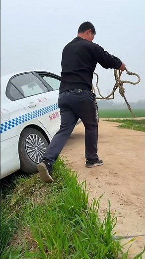 While Reversing, The Car Accidentally Fell Off The Curb, With The Wheels Dangling In The Air.