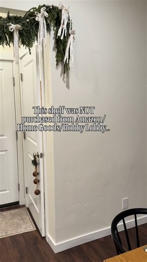 Nikki Chmiel | Home & DIY on Instagram: "I absolutely love this shelf. ✨ Everyone keeps asking me where I purchased this shelf from but I truly built it with just a few materials from Lowe’s. I then assembled, stained and secured it to my wall. And you can do the same!!! This is such an easy simple project! Just go for it! 💪 I’m so happy that I decided to add the wooden pegs below the shelf in order to hang some other meaningful decor and momentum’s on. 🤍 • • #OldHouseLove #HomeRenovation #FYP