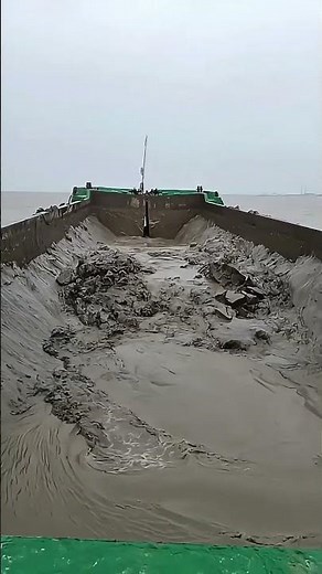 Split Hull Dump Barge Discharging Dredged Material