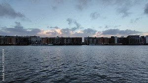 Skyline of Amsterdam at Javakade on Java eiland on the IJhaven at dusk, view over the water, exterior shot