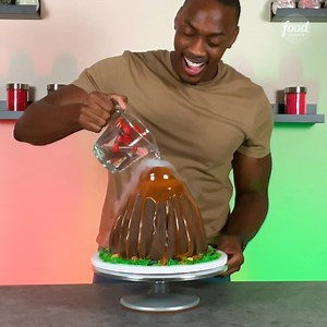 This explosive cake from The Sweet Impact is finished with dry ice smoke and rushing lava icing! (Just WAIT until you see the technique at 1:09!) | Food Network