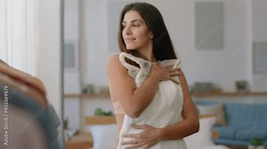 beautiful woman bride getting dressed looking in mirror with wedding dress at home Stock Video