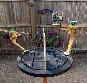 Testing out my new battle arena I made for the WoodBots 🚨🍻 Shotgun Showdown 🍻🚨 ♻️🛹 Handcrafted from recycled skateboards and wood, each one is built to last, reset, and play again The ultimate party duel—two fighters, one goal: crack your opponent’s can (or balloon) before they crack yours. Fast hands, sharp aim, and a little friendly chaos make for an unforgettable showdown. ⚠️ Important: I have no third-party sellers. The only place to get an official Shotgun Showdown is directly from me 