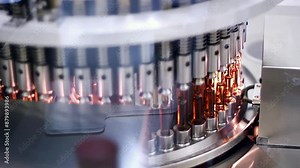 Automated Visual Inspection Machine for Pharmaceutical Ampoules and Vials. Inspects Ampoules for Particulates in Liquid and Container Defects. Pharmaceutical Manufacturing Machine. Pharma Industry.