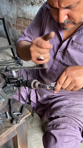 Watch the fascinating process of crafting a small metal spring using only a hand-powered machine and simple tools. No electricity, just pure skill and experience from a master spring maker. A perfect example of traditional craftsmanship still alive today! #SpringMaking #HandmadeProcess #TraditionalCraft #Metalwork #SkilledMaker #WorkshopArt #Craftsmanship #HandTools #WireToSpring #OldTech #NoElectricity #ASMRMetalwork | Creators Craft