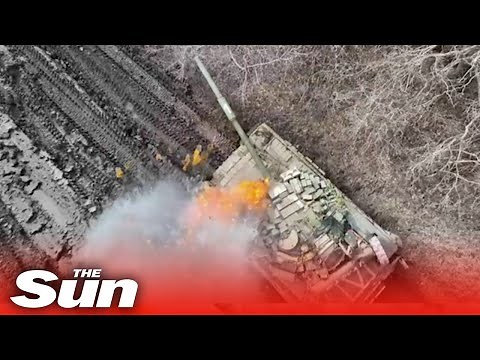 Russian tanks explode as Ukrainian drones drop bombs into open hatches