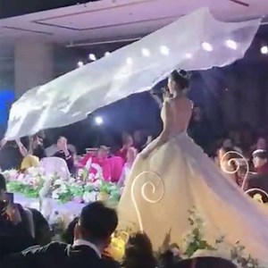 5.6M views · 1.2K reactions | Flying veils that dramatically land on the bride are the hottest wedding trend in China  | In The Know | Facebook